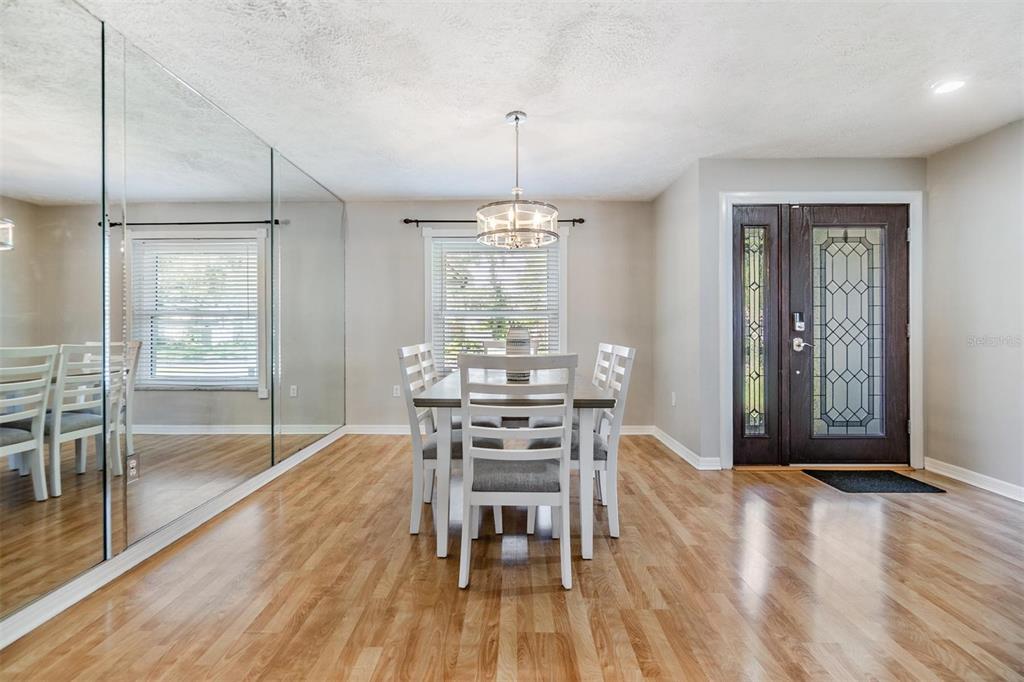 1 Fernery Lane Safety Harbor, FL 34695 - Photo 37 of 44 a view of a dining room with furniture window and wooden floor