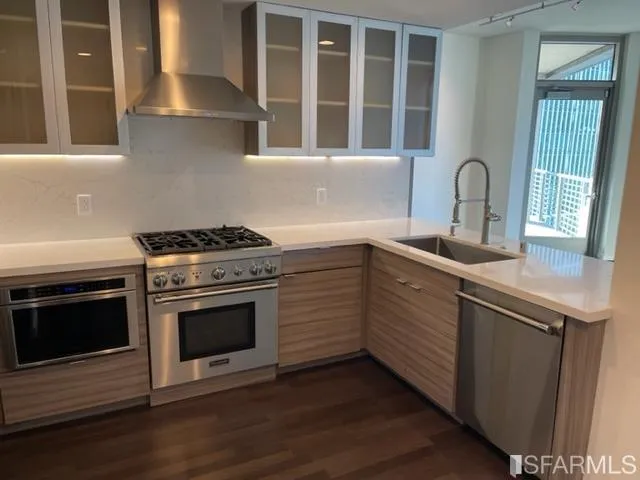 a kitchen with a stove oven and sink