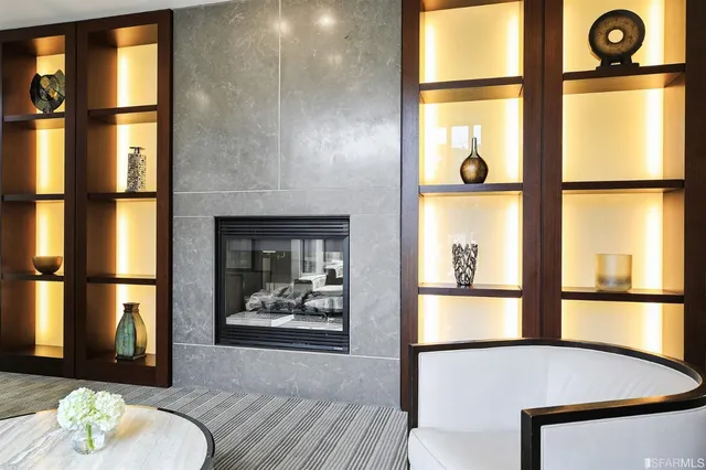 a living room filled with furniture and a window