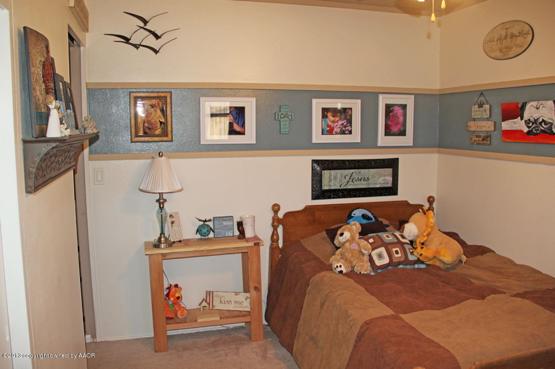 5016 South Bonham Street Amarillo, TX 79110 - Photo 16 of 31 a bedroom with furniture and a bedroom