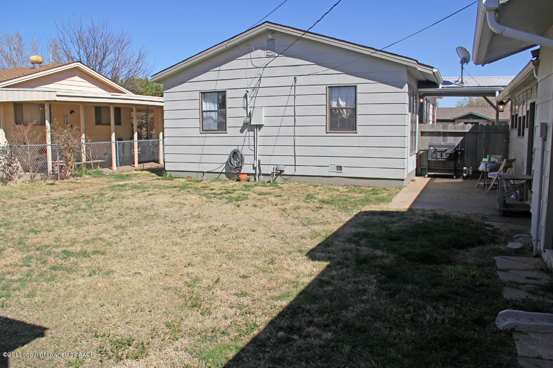 5016 South Bonham Street Amarillo, TX 79110 - Photo 25 of 31 a front view of a house with a yard