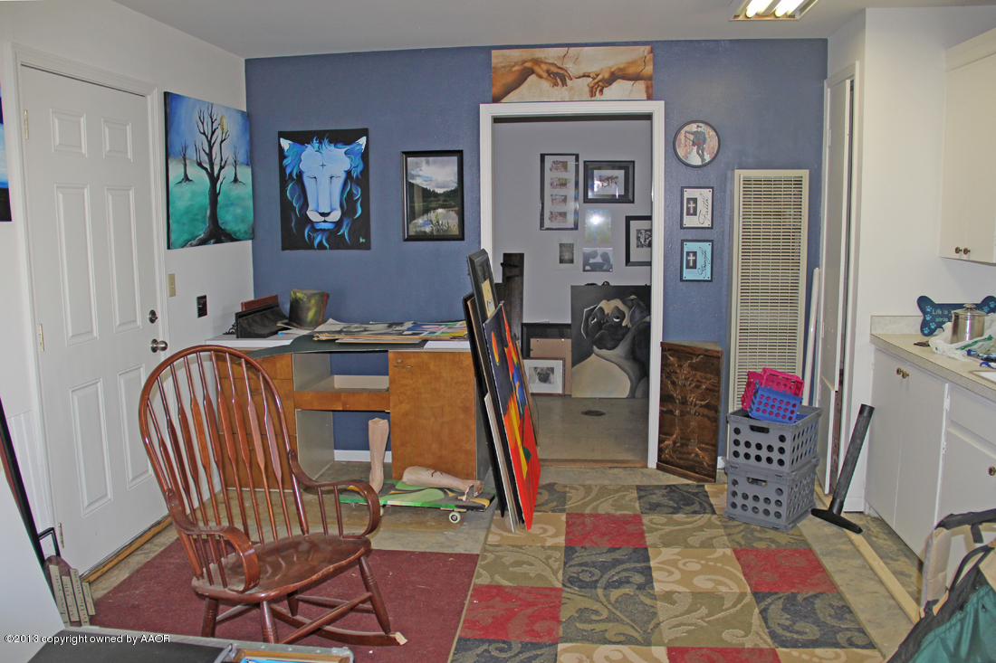 5016 South Bonham Street Amarillo, TX 79110 - Photo 30 of 31 a room that has a couch and a table in it