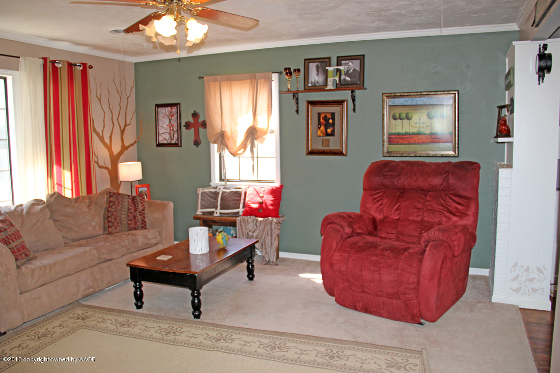 5016 South Bonham Street Amarillo, TX 79110 - Photo 6 of 31 a living room with furniture and a window