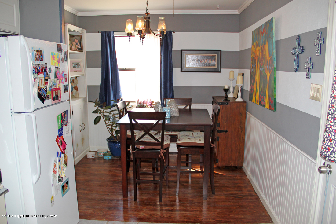 5016 South Bonham Street Amarillo, TX 79110 - Photo 7 of 31 a view of a dining room with furniture and a chandelier