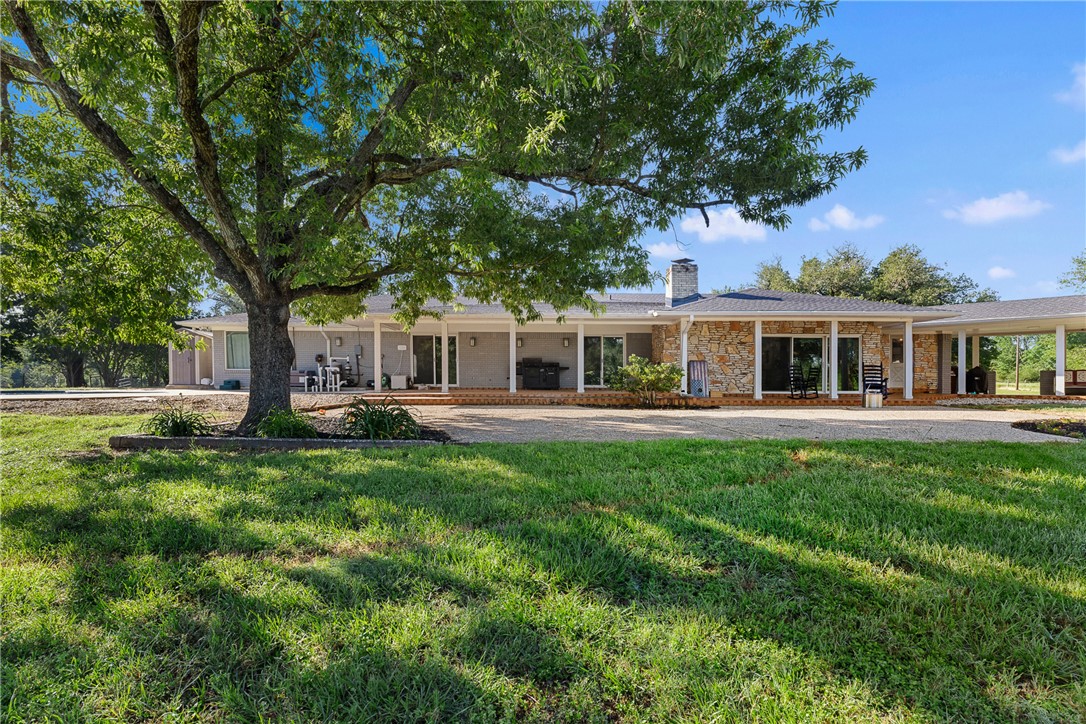 871 Cazey Loop Franklin, TX 77856 - Photo 42 of 42 a front view of house with yard and green space