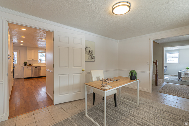1045 Fox Farm Road Logan, UT 84321 - Photo 14 of 65 Office area with a textured ceiling, light tile patterned flooring, plenty of natural light, and crown molding