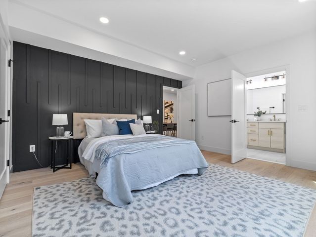 a bedroom with a bed and a view of bathroom