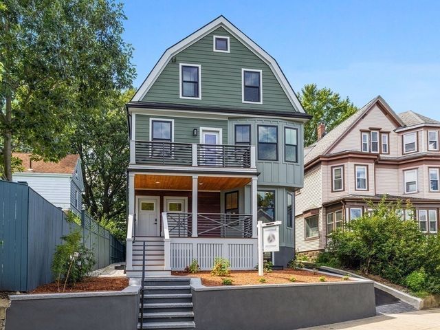 a front view of a house with swimming pool
