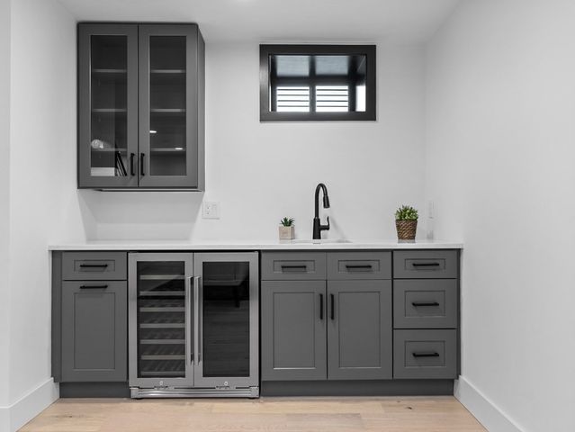 a view of a sink and mirror in a room