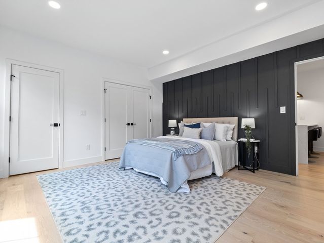 a bedroom with a bed and a walk in closet