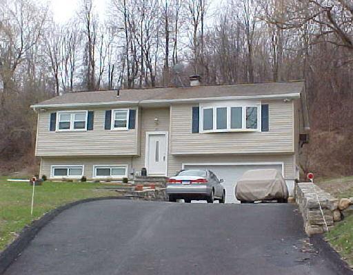 a view of a car parked in front of a house