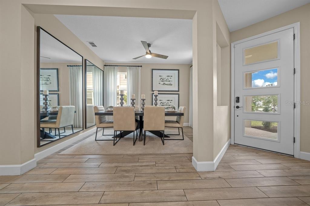 3916 Southern Vista Loop St. Cloud, FL 34772 - Photo 16 of 50 a view of a livingroom with furniture and an entryway