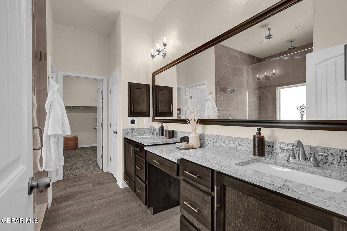 7625 Enchanted Ridge Drive El Paso, TX 79911 - Photo 51 of 57 a bathroom with double vanity and a mirror