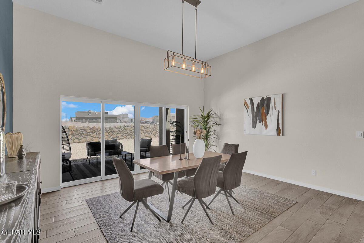 7625 Enchanted Ridge Drive El Paso, TX 79911 - Photo 6 of 57 a view of a dining room with furniture window and wooden floor
