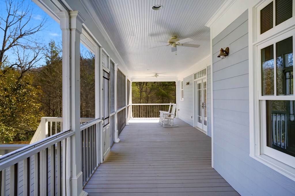 416 Tobe Stalcup Road Murphy, NC 28906 - Photo 53 of 60 a view of a porch with wooden floor and iron stairs