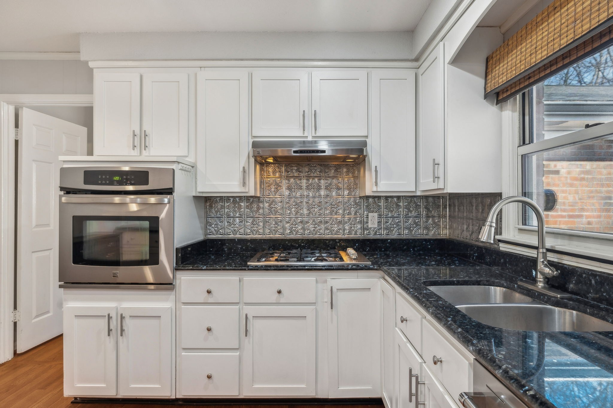 4 Trahern Terrace Clarksville, TN 37040 - Photo 15 of 66 a kitchen with granite countertop white cabinets and stainless steel appliances