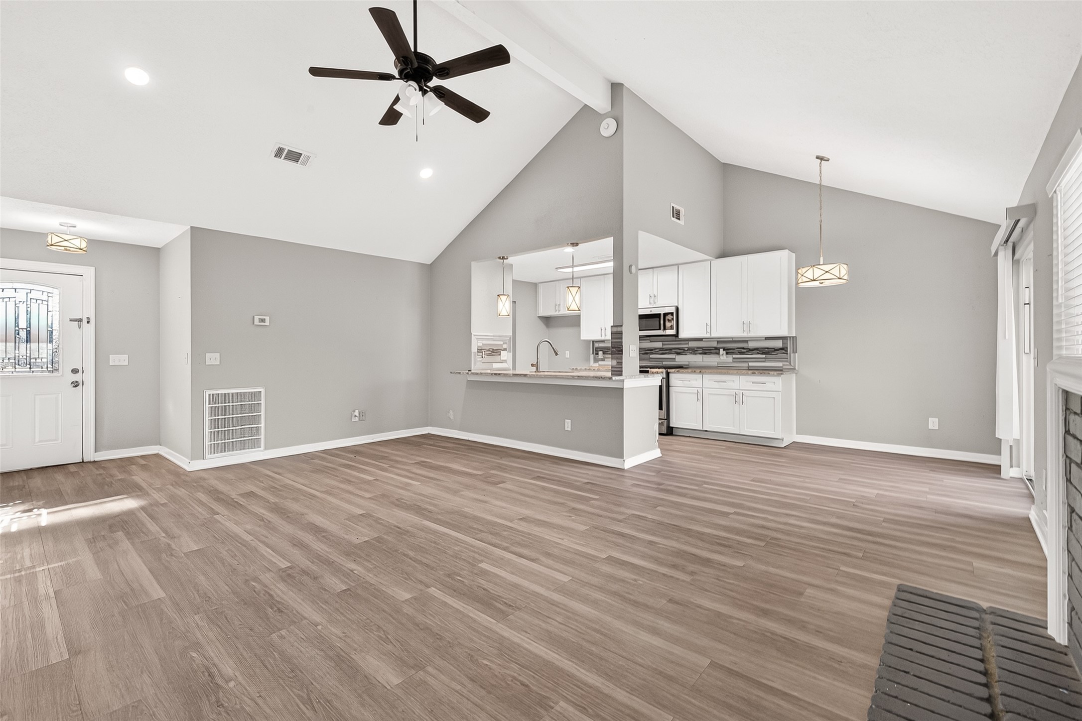 9507 Secretariat Drive Houston, TX 77065 - Photo 14 of 41 a view of a kitchen with a stove cabinets and wooden floor