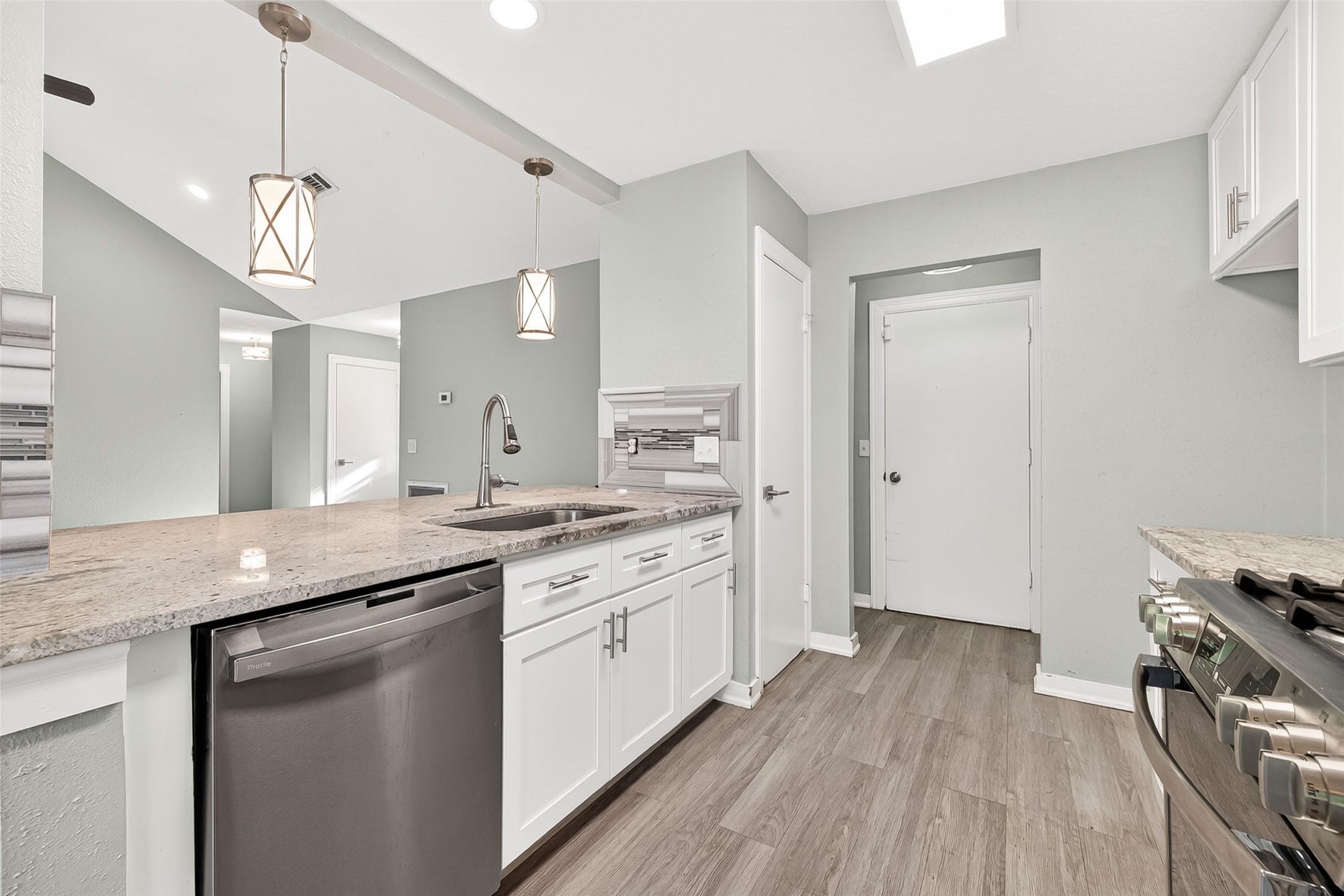 9507 Secretariat Drive Houston, TX 77065 - Photo 17 of 41 a kitchen with a sink stainless steel appliances a counter space and a window