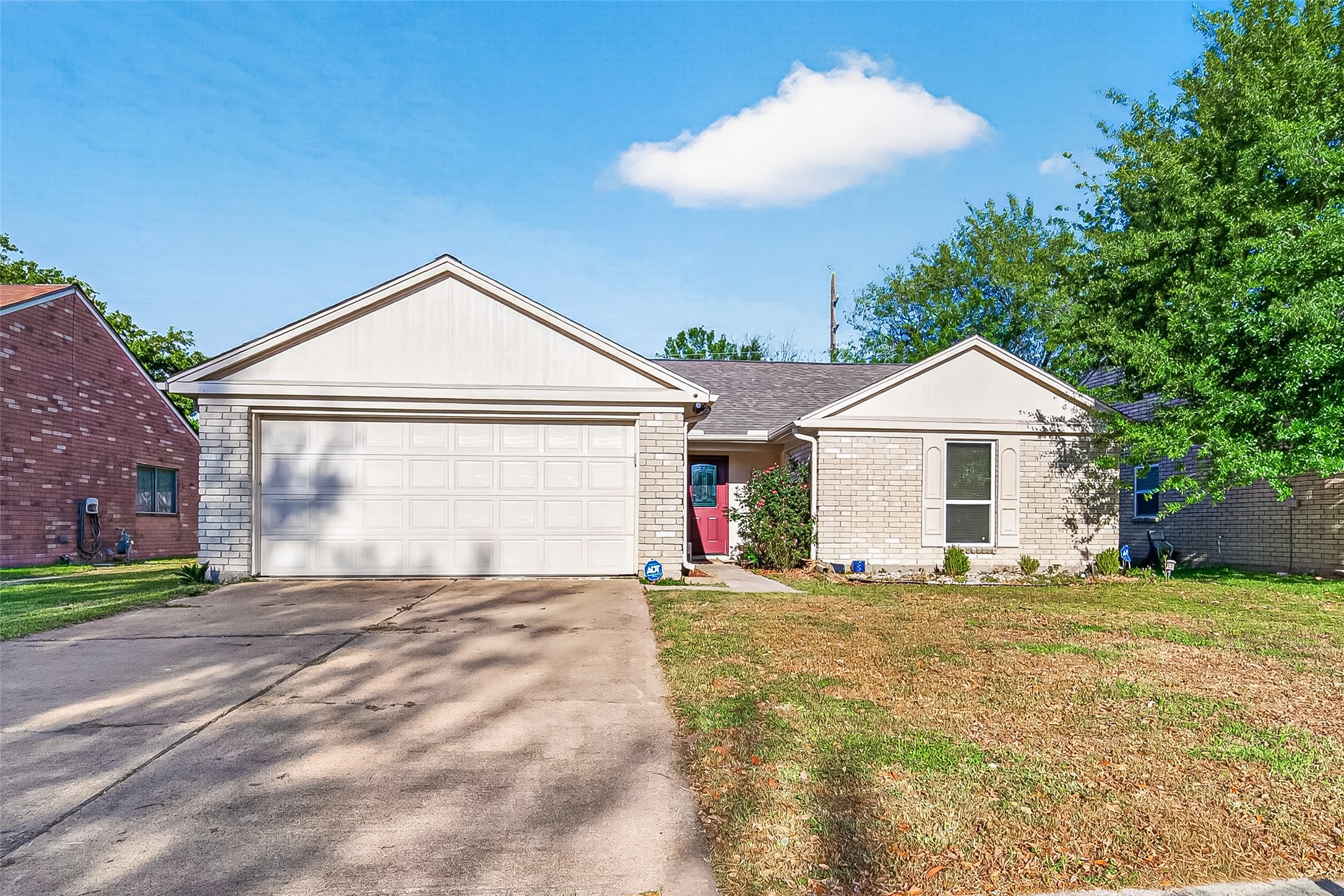 9507 Secretariat Drive Houston, TX 77065 - Photo 2 of 41 a view of a house with a yard and garage
