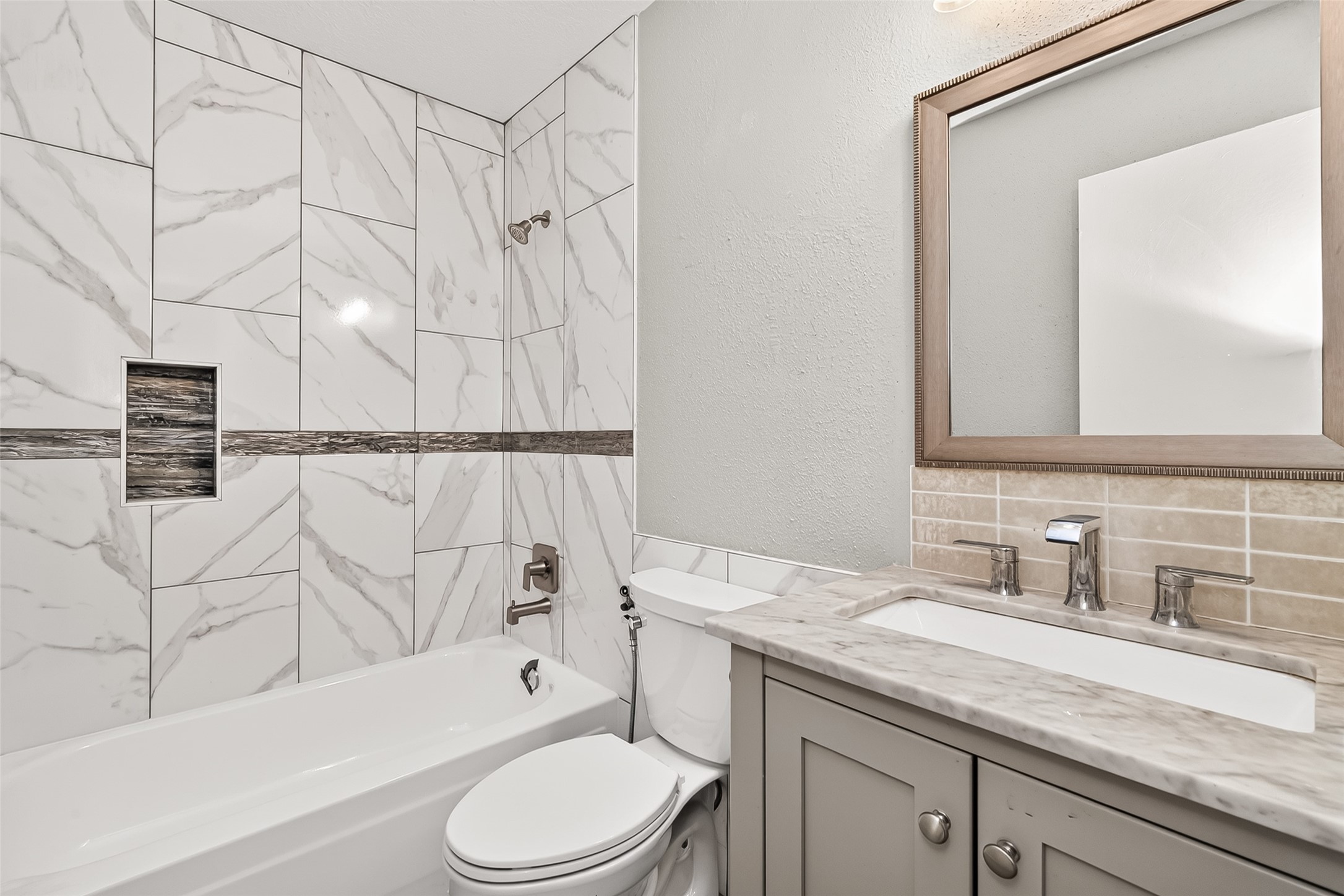 9507 Secretariat Drive Houston, TX 77065 - Photo 21 of 41 a bathroom with a granite countertop bathtub sink vanity mirror and toilet