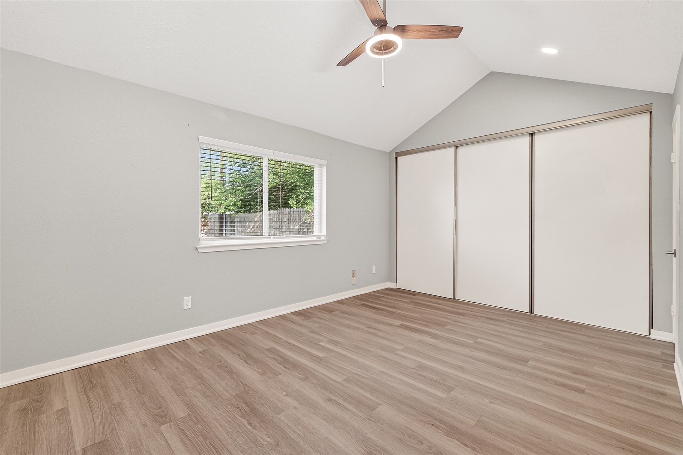 9507 Secretariat Drive Houston, TX 77065 - Photo 22 of 41 wooden floor in an empty room with a window
