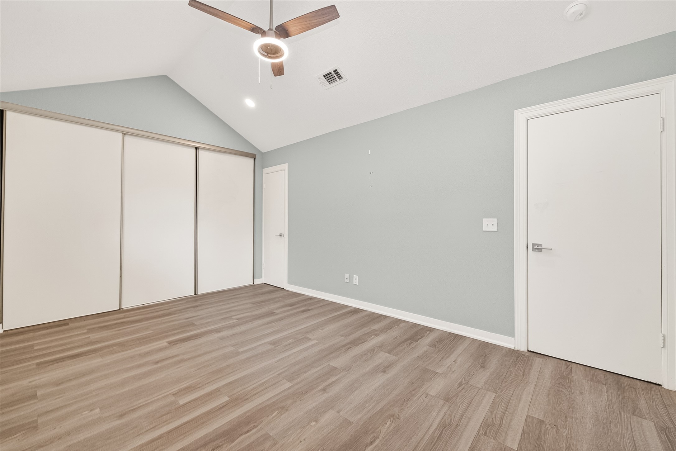 9507 Secretariat Drive Houston, TX 77065 - Photo 23 of 41 a view of an empty room with wooden floor
