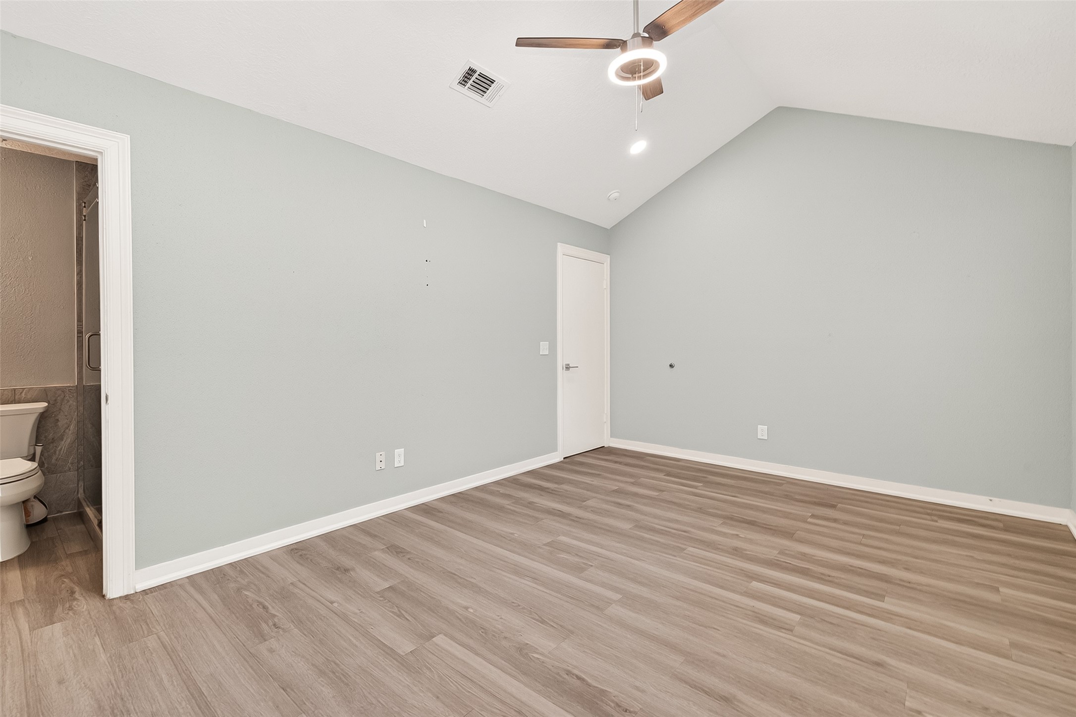 9507 Secretariat Drive Houston, TX 77065 - Photo 24 of 41 an empty room with wooden floor and windows