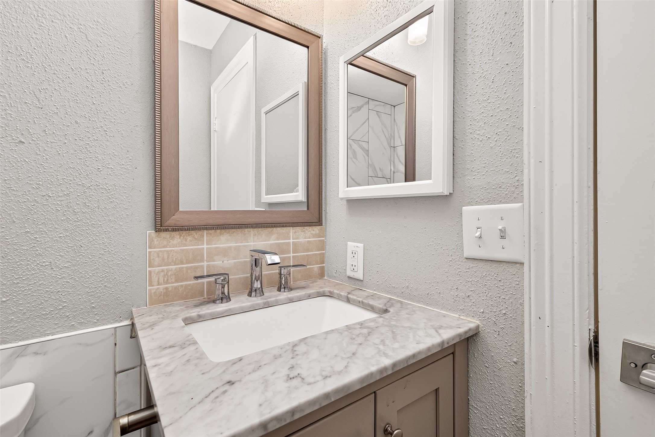9507 Secretariat Drive Houston, TX 77065 - Photo 26 of 41 a bathroom with a granite countertop sink and a mirror