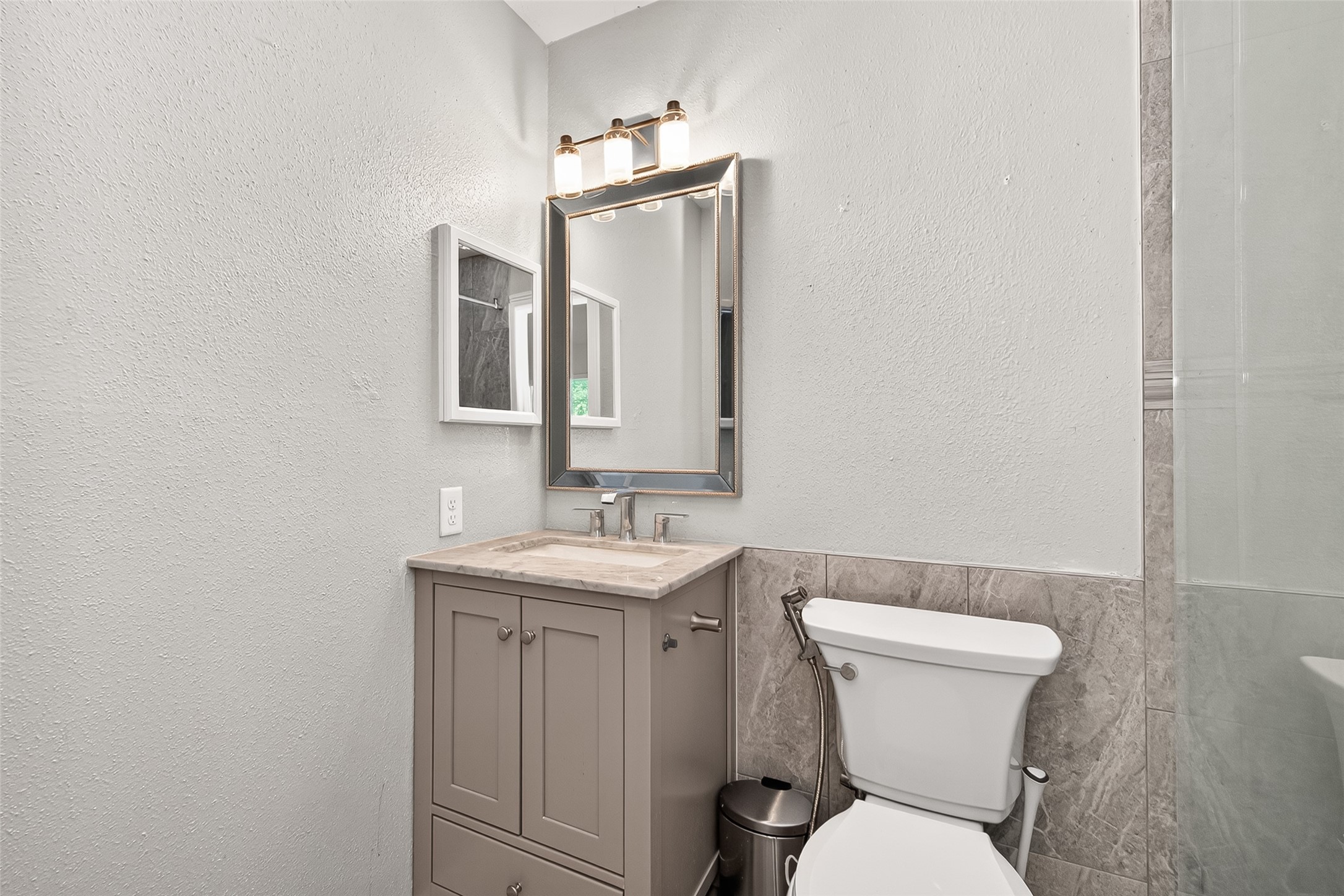 9507 Secretariat Drive Houston, TX 77065 - Photo 27 of 41 a bathroom with a toilet sink and mirror