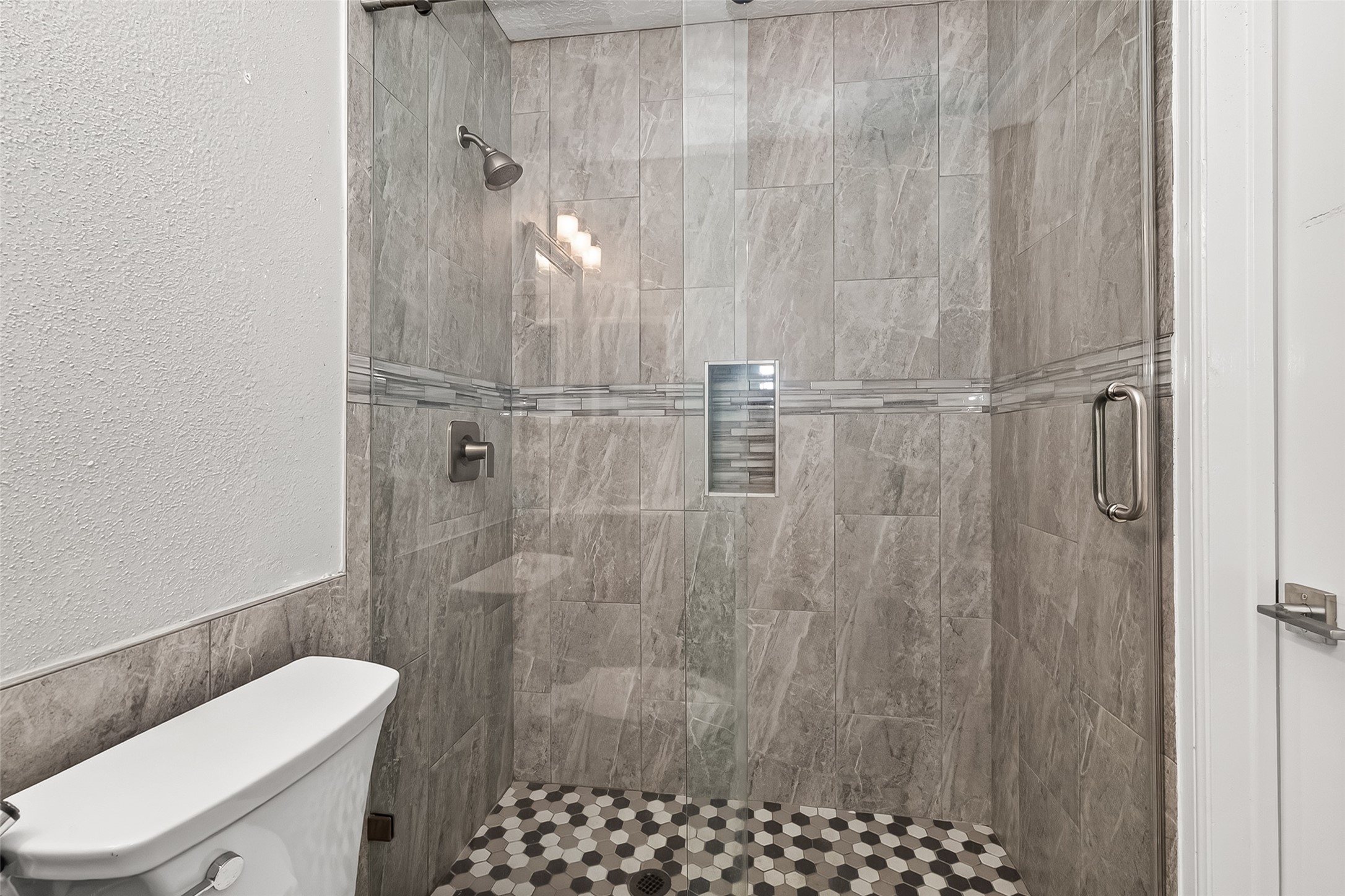 9507 Secretariat Drive Houston, TX 77065 - Photo 28 of 41 a bathroom with a shower and toilet