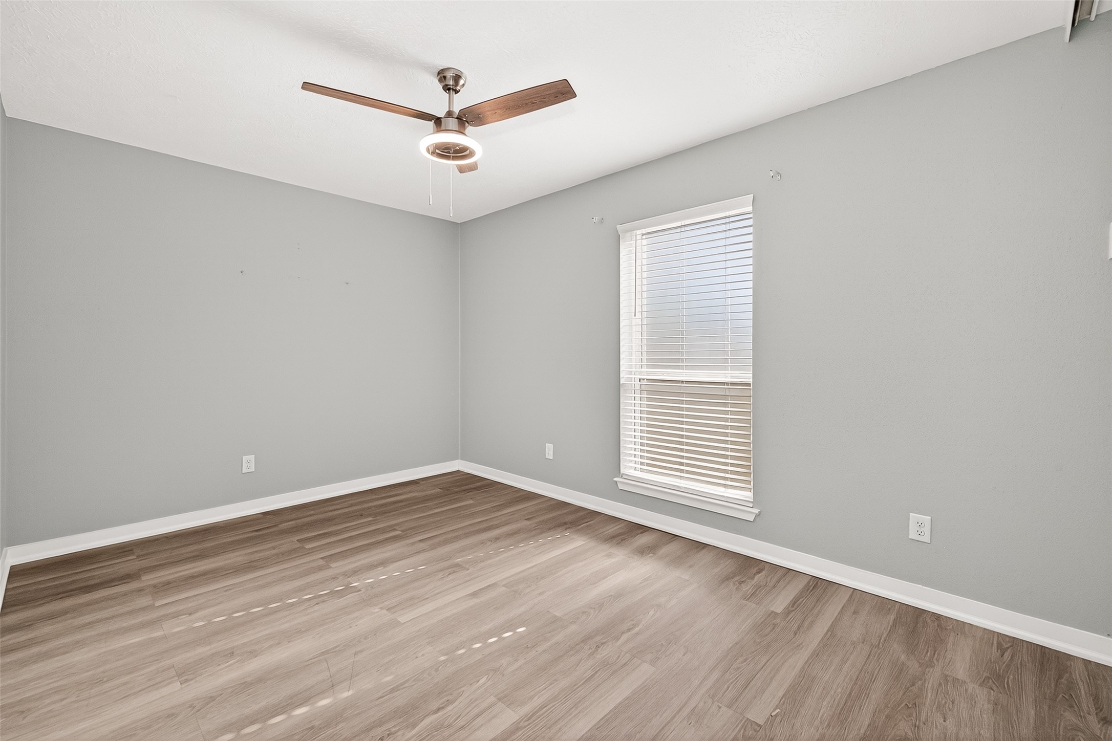 9507 Secretariat Drive Houston, TX 77065 - Photo 33 of 41 wooden floor in an empty room with a window