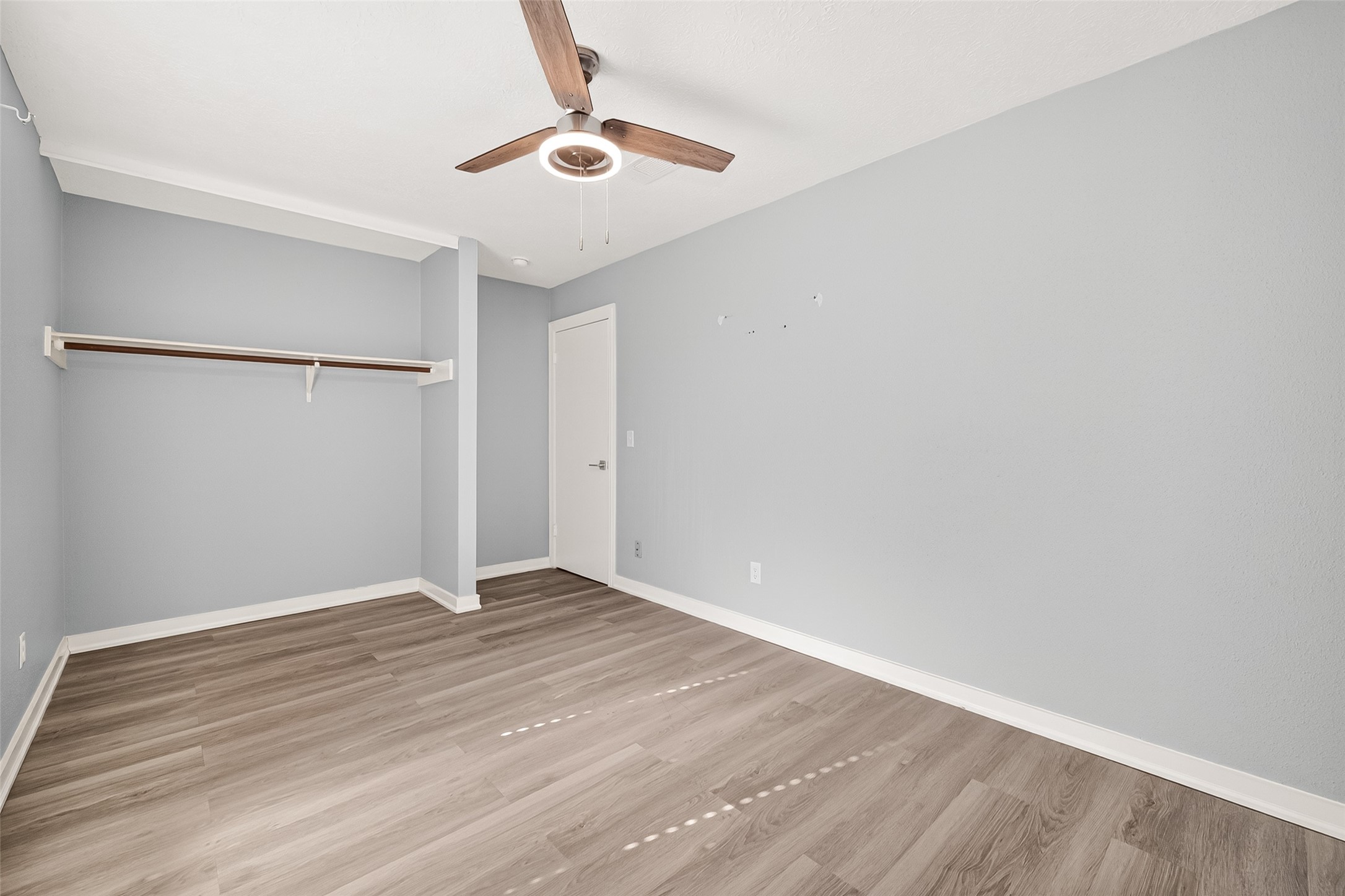 9507 Secretariat Drive Houston, TX 77065 - Photo 35 of 41 a view of an empty room with wooden floor