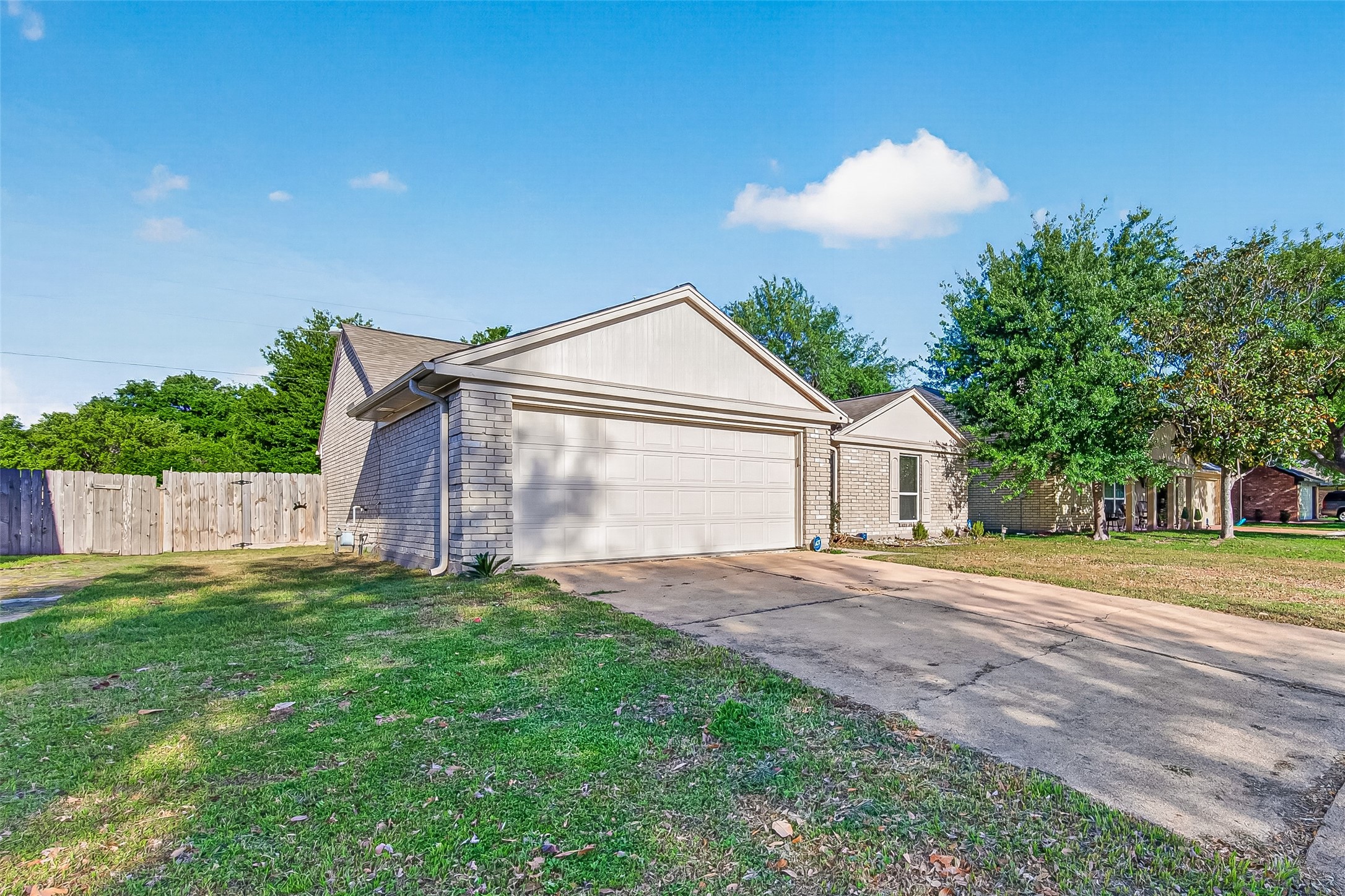 9507 Secretariat Drive Houston, TX 77065 - Photo 4 of 41 a front view of a house with a yard and garage