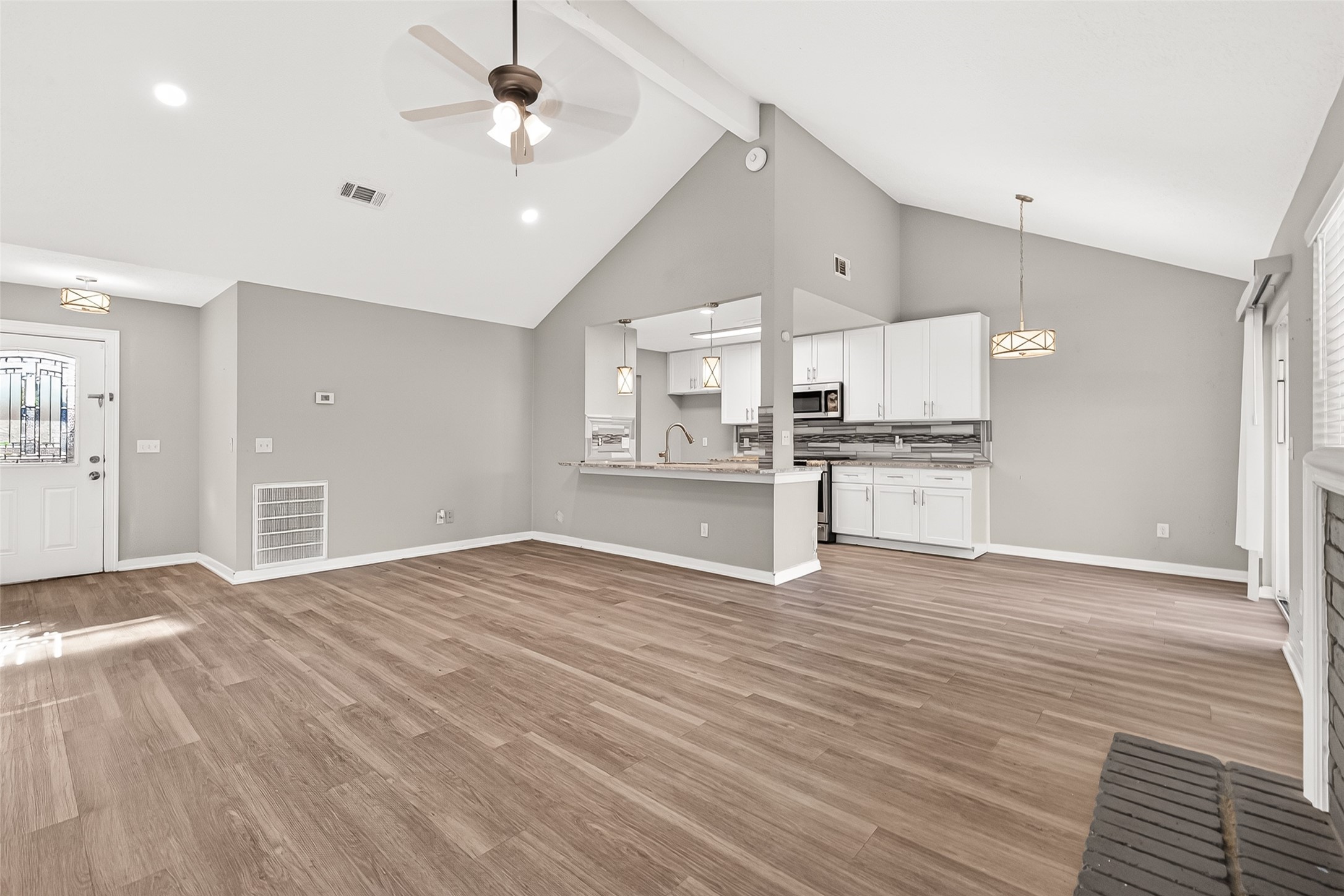 9507 Secretariat Drive Houston, TX 77065 - Photo 9 of 41 a view of a kitchen with a stove cabinets and wooden floor