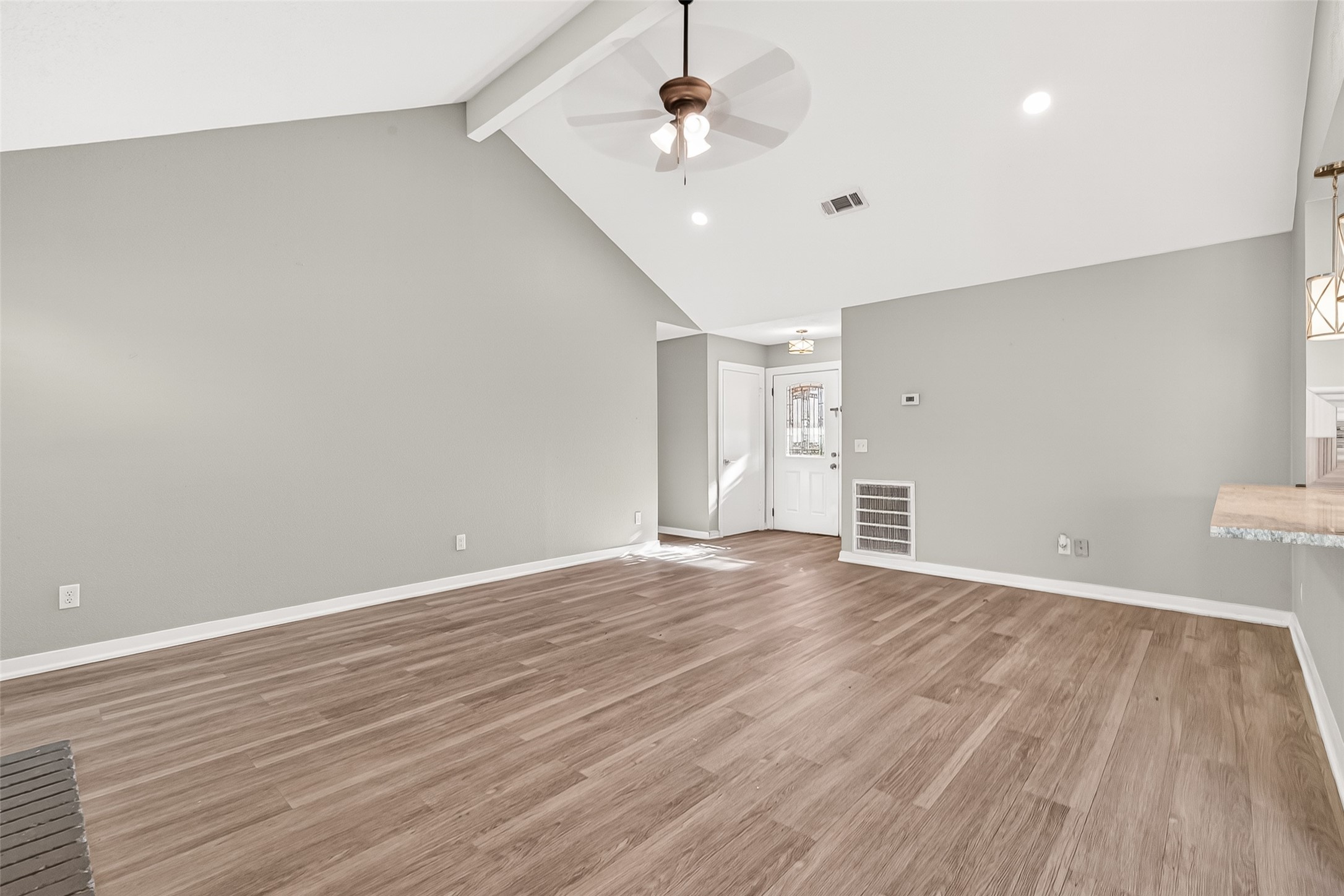 9507 Secretariat Drive Houston, TX 77065 - Photo 10 of 41 a view of empty room with wooden floor and fan