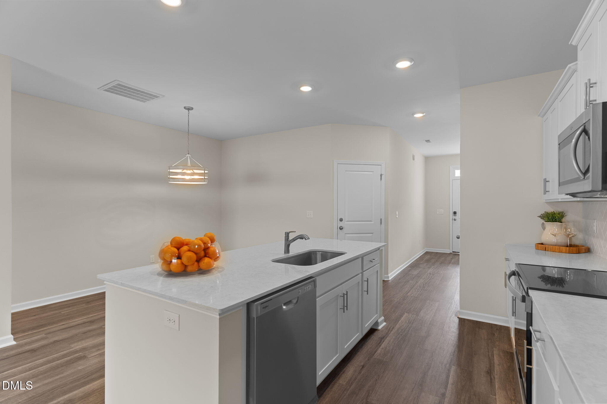 212 Kerag Way Garner, NC 27529 - Photo 12 of 28 a kitchen with a sink a counter space and cabinets