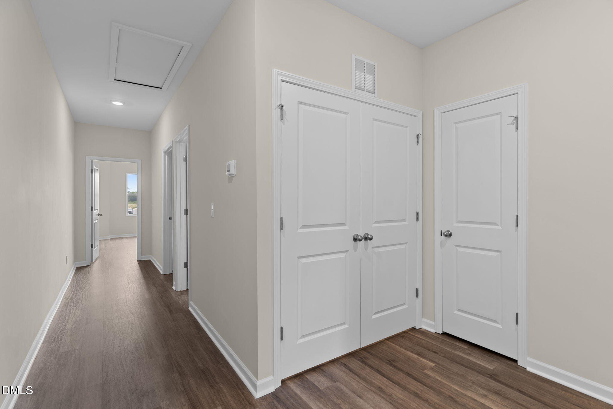 212 Kerag Way Garner, NC 27529 - Photo 16 of 28 a view of a hallway with wooden floor