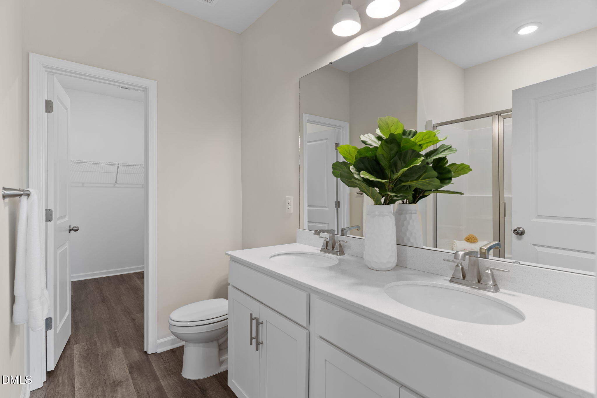 212 Kerag Way Garner, NC 27529 - Photo 21 of 28 a bathroom with a toilet sink vanity granite and mirror