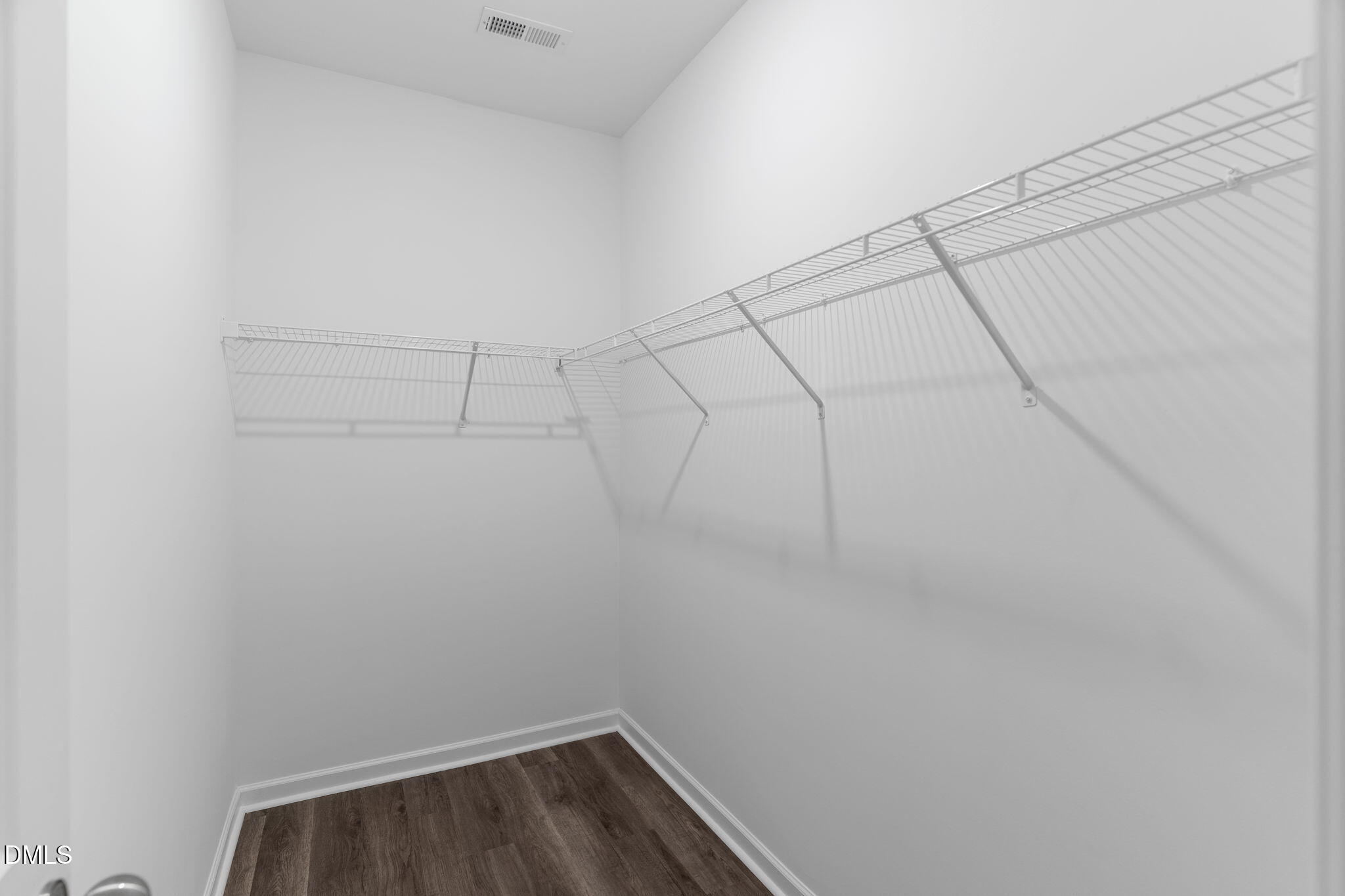 212 Kerag Way Garner, NC 27529 - Photo 25 of 28 a view of a room with racks on the wall