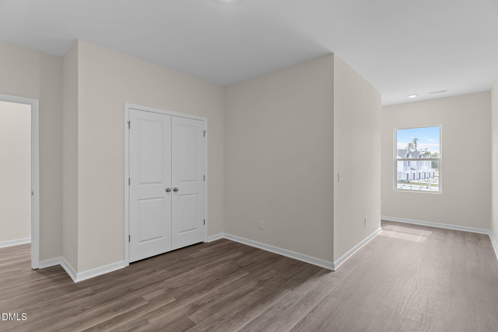 212 Kerag Way Garner, NC 27529 - Photo 28 of 28 an empty room with wooden floor & windows
