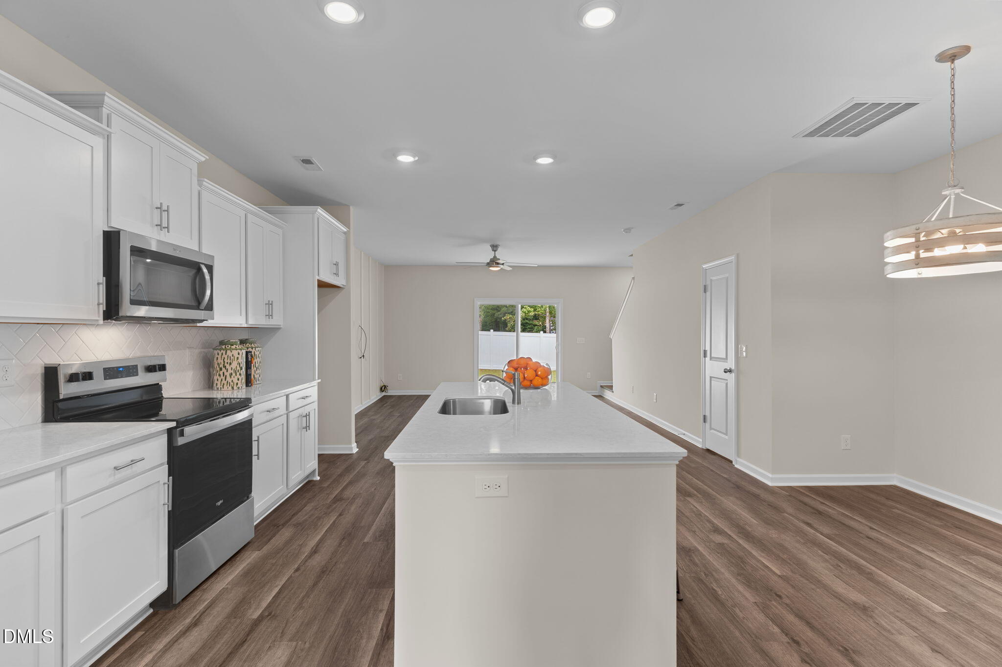 212 Kerag Way Garner, NC 27529 - Photo 7 of 28 a kitchen that has a sink and a stove in it