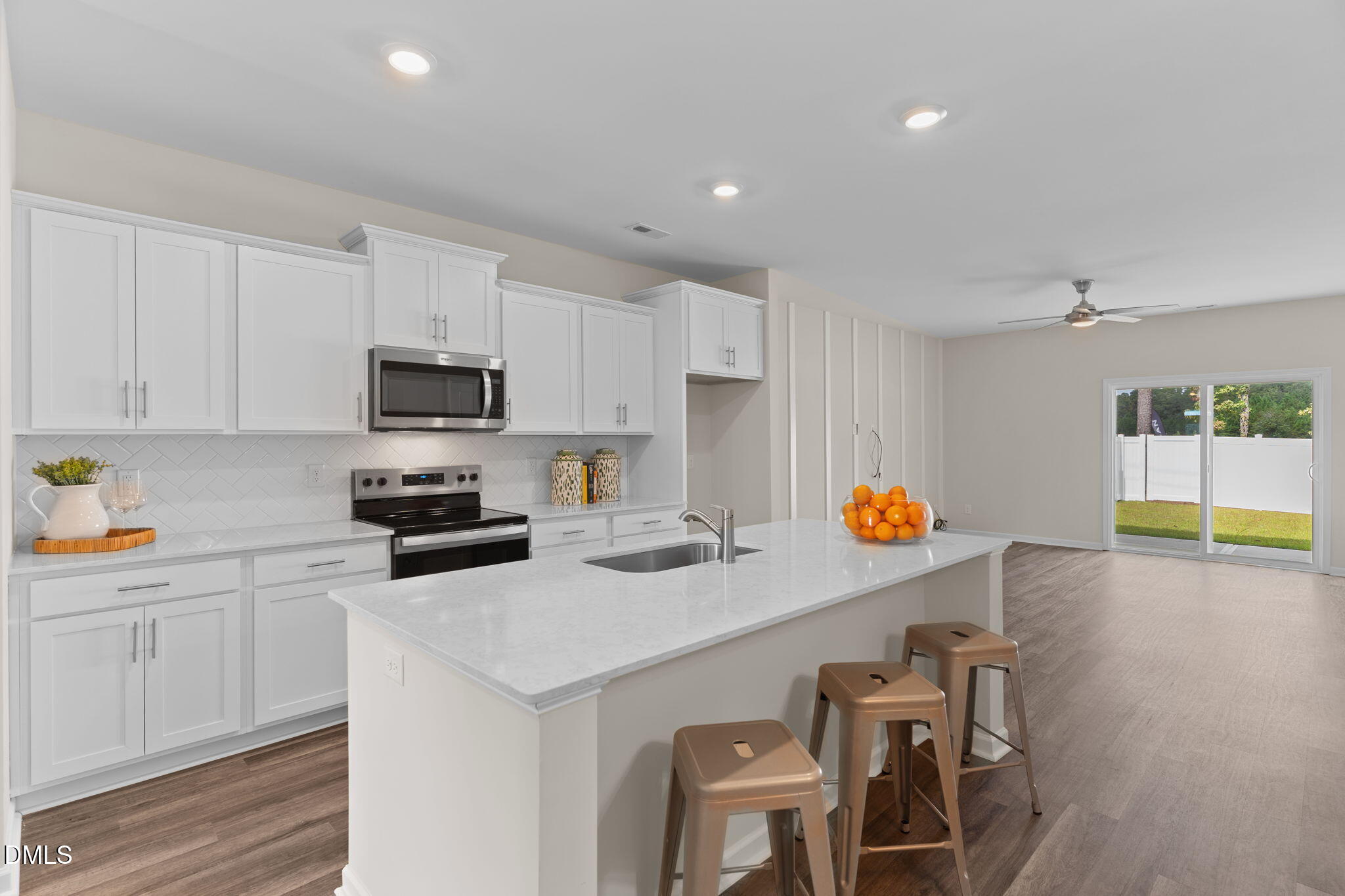 212 Kerag Way Garner, NC 27529 - Photo 8 of 28 a kitchen with a sink a stove a table and chairs