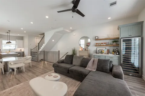 a bathroom with a double vanity sink mirror and toilet