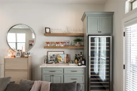 a bathroom with a double vanity sink mirror and shower