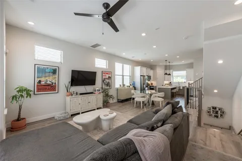a view of a house with backyard and wooden fence