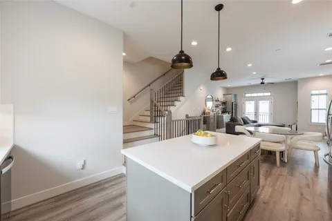 a open kitchen with a table and chairs