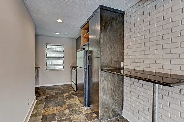 a bathroom with a shower and a mirror