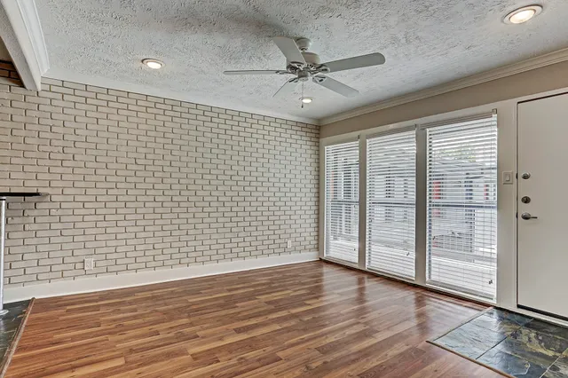 a view of a livingroom with wooden floor