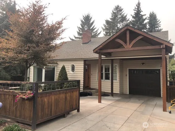 a front view of a house with yard