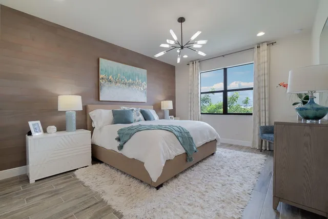 a white toilet sitting next to a white wall